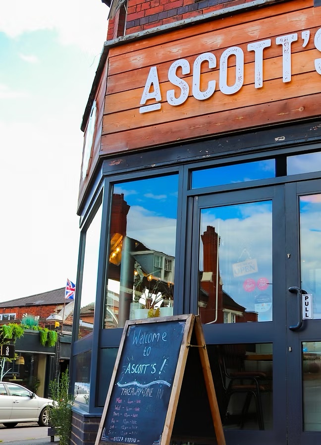 Exterior view of Ascott's Restaurant with welcoming entrance and signage.