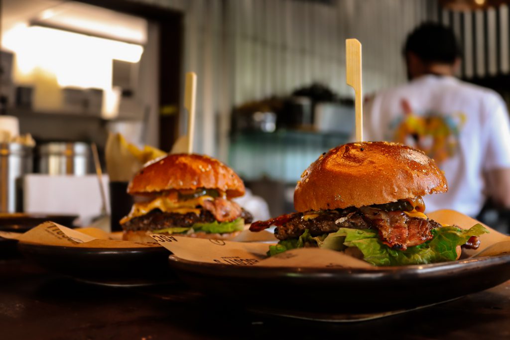 Delicious beef burgers with fresh lettuce and toppings at Ascotts Restaurant, Bromsgrove.