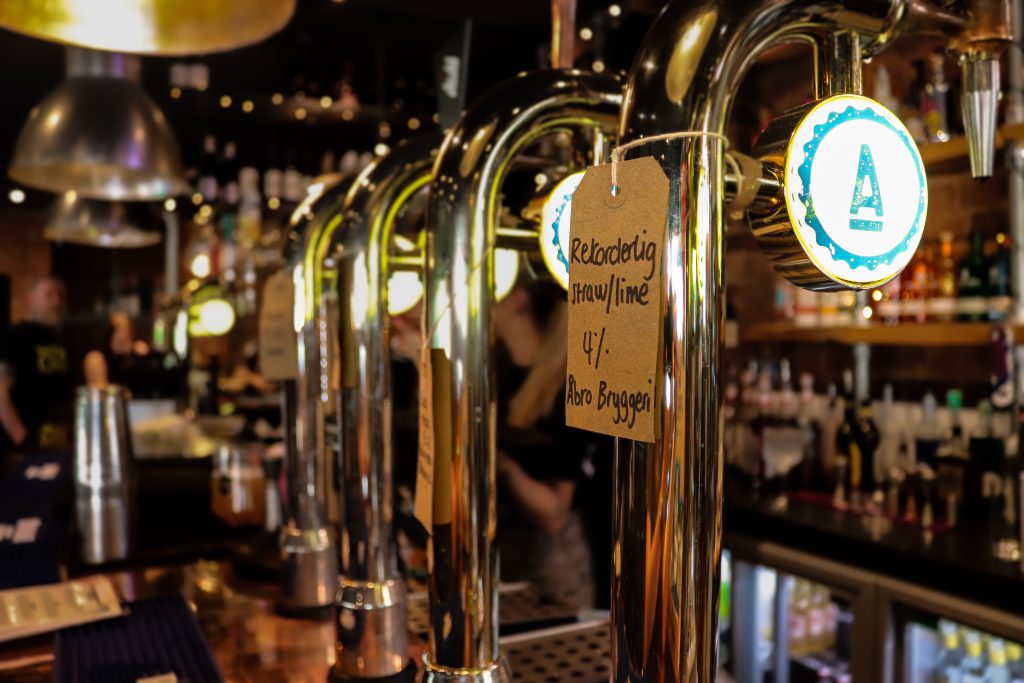 Bar taps at Ascotts Restaurant in Bromsgrove, showcasing a lively and inviting atmosphere.